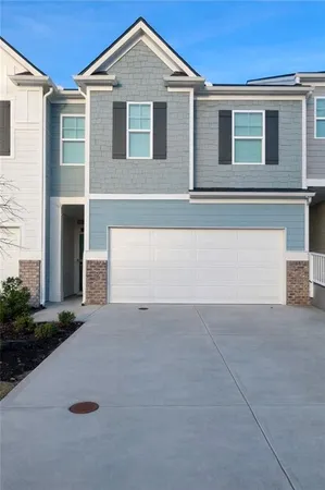 a kitchen with granite countertop a sink stove and refrigerator