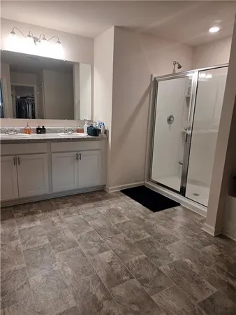 a view of walk in closet with clothes