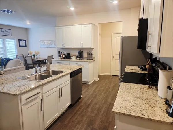 a living room with furniture and flat screen tv