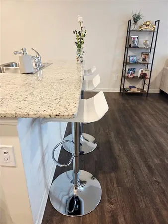 a view of walk in closet with clothes