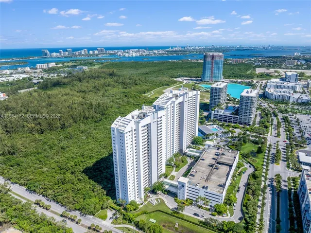 an aerial view of a house with a garden and swimming pool