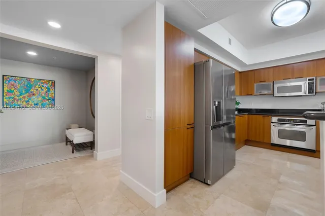 a spacious bathroom with a toilet sink and a mirror