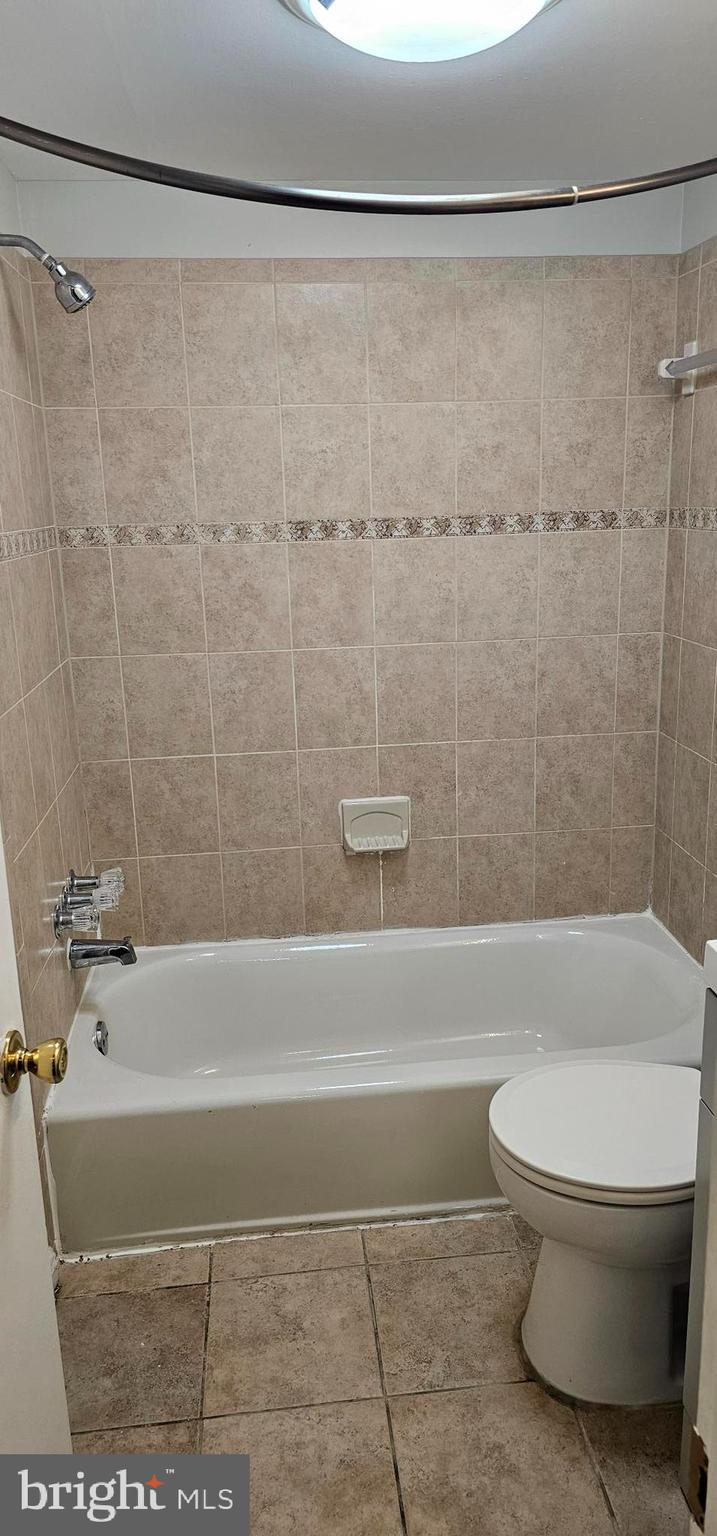 1802 Metzerott Road, Unit 503 Silver Spring, MD 20903 - Photo 6 of 11 a bathroom with a toilet and a shower