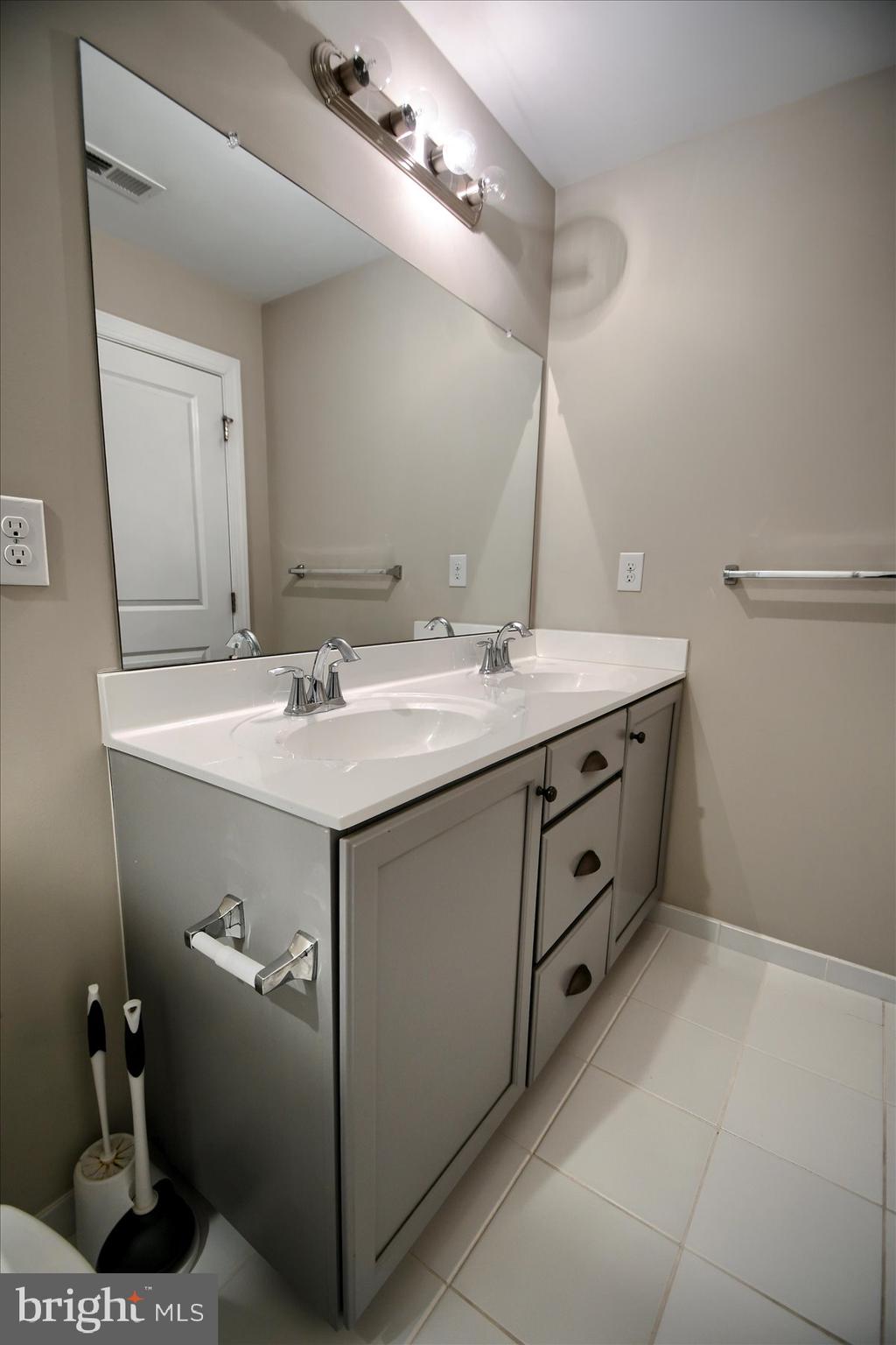 39 North Mitchell Avenue Lansdale, PA 19446 - Photo 22 of 39 a bathroom with a sink double vanity and a mirror