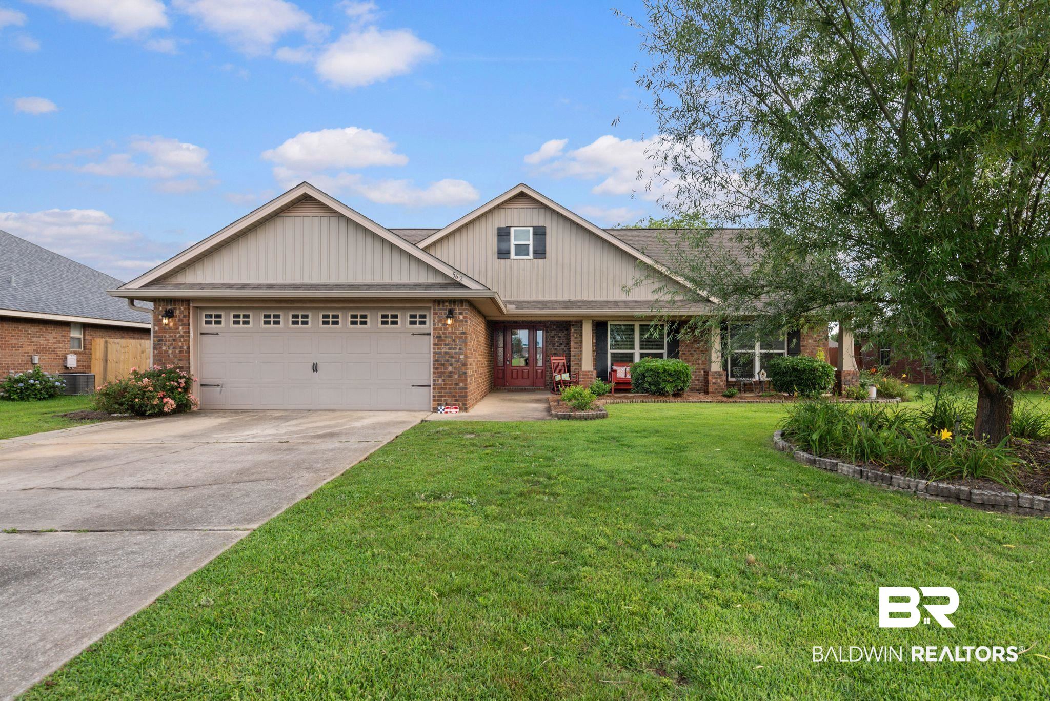 562 Vestige Mews Foley, AL 36535 - Photo 1 of 54 Brick and siding exterior with a two-car garage