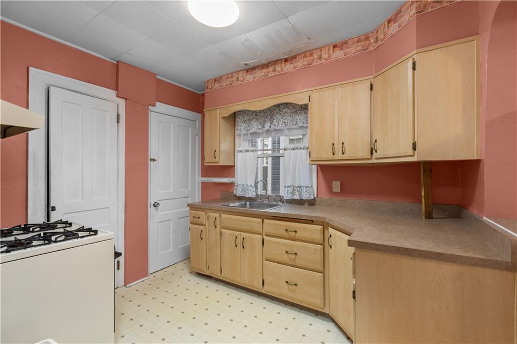 706 Nevin Avenue Sewickley, PA 15143 - Photo 14 of 40 a kitchen with a sink and cabinets