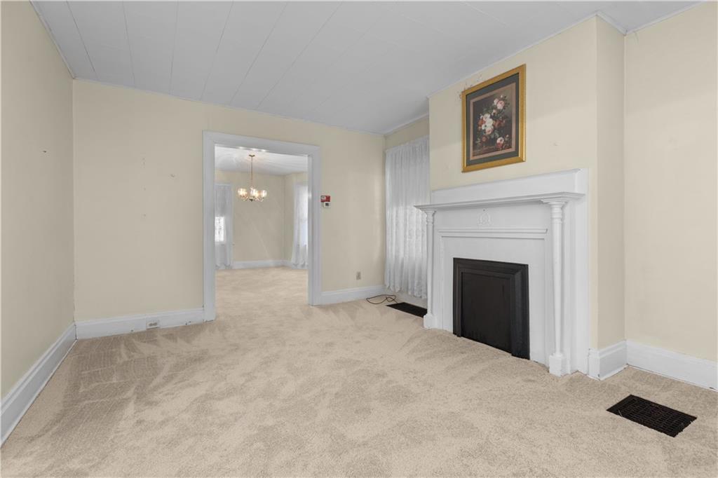 706 Nevin Avenue Sewickley, PA 15143 - Photo 10 of 40 a view of an empty room with a fireplace