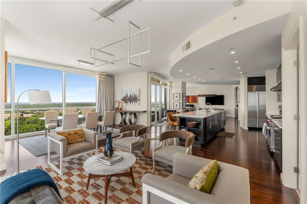 3325 Piedmont Road Northeast, Unit 2006 Atlanta, GA 30305 - Photo 16 of 78 a living room with furniture kitchen view and a large window