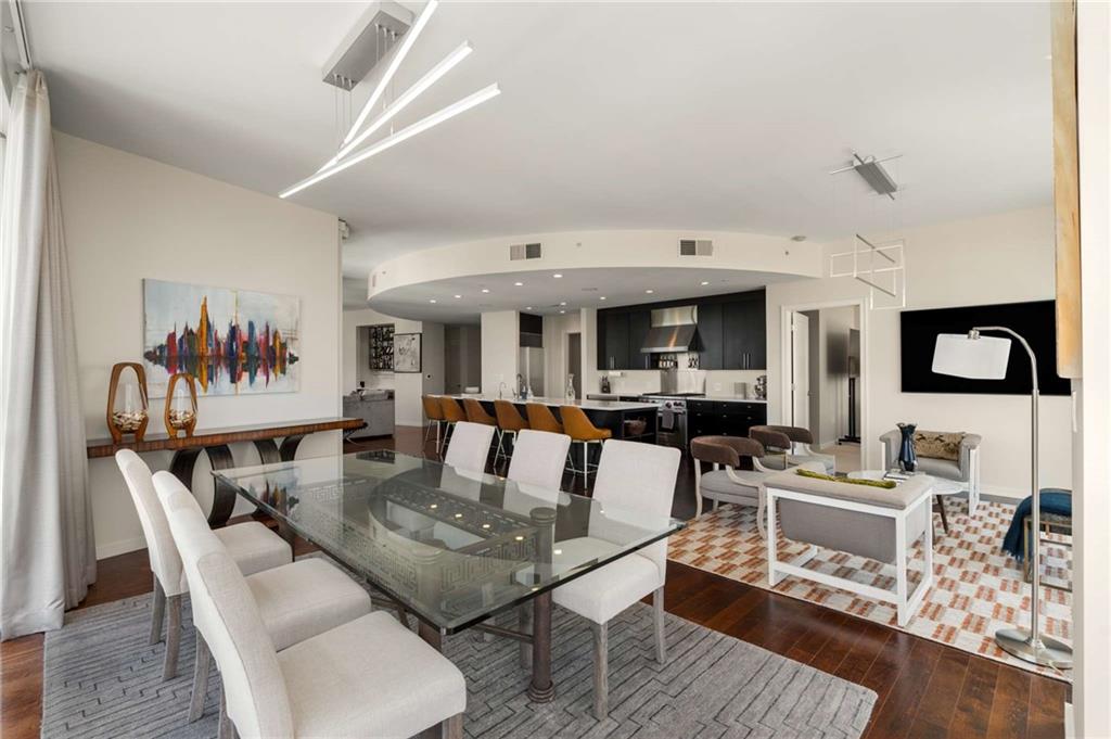 3325 Piedmont Road Northeast, Unit 2006 Atlanta, GA 30305 - Photo 17 of 78 a living room with furniture and wooden floor