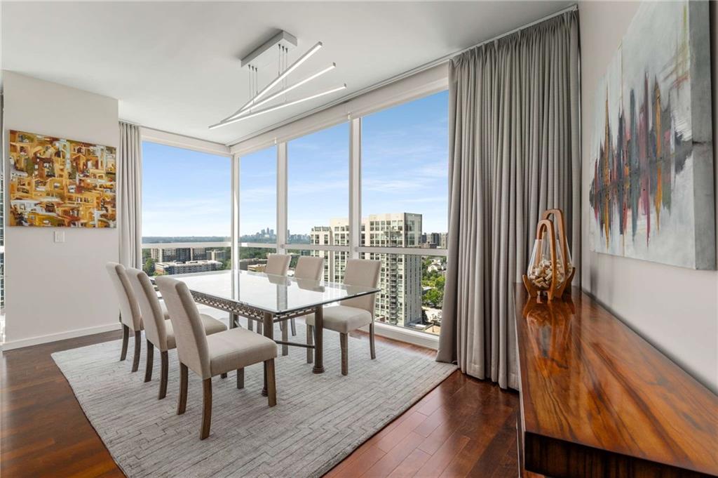3325 Piedmont Road Northeast, Unit 2006 Atlanta, GA 30305 - Photo 18 of 78 a dining room with furniture window and wooden floor