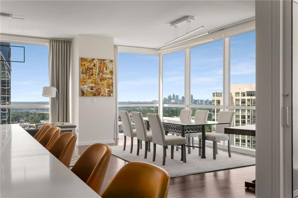 3325 Piedmont Road Northeast, Unit 2006 Atlanta, GA 30305 - Photo 20 of 78 a dining room with furniture window and wooden floor