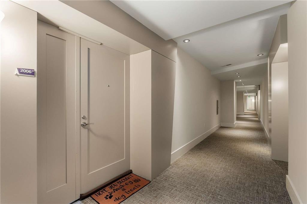 3325 Piedmont Road Northeast, Unit 2006 Atlanta, GA 30305 - Photo 2 of 78 a view of a hallway with wooden floor