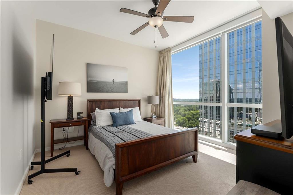 3325 Piedmont Road Northeast, Unit 2006 Atlanta, GA 30305 - Photo 22 of 78 a living room with furniture and a floor to ceiling window