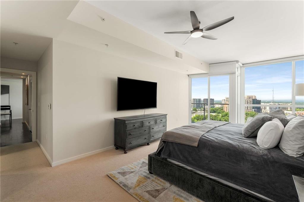 3325 Piedmont Road Northeast, Unit 2006 Atlanta, GA 30305 - Photo 29 of 78 a bedroom with a bed and a television