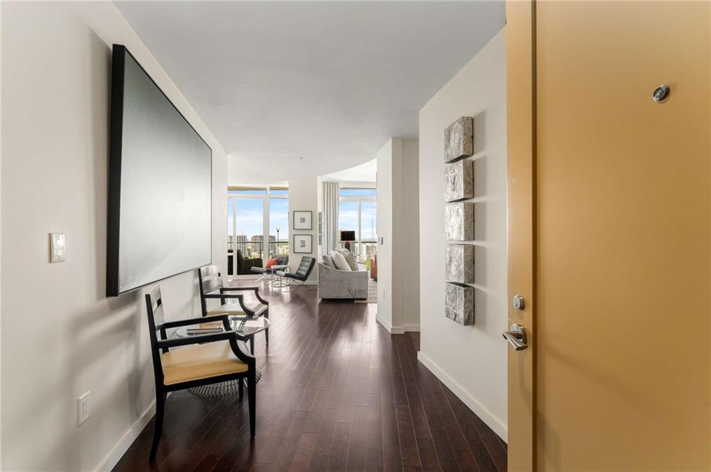 3325 Piedmont Road Northeast, Unit 2006 Atlanta, GA 30305 - Photo 4 of 78 a view of a livingroom with furniture and wooden floor