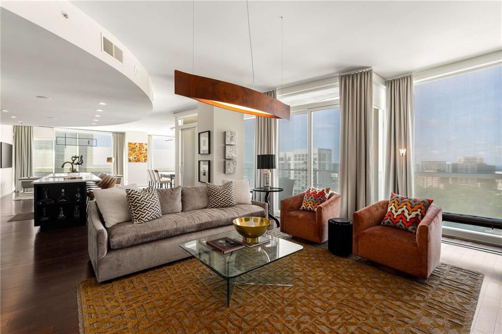 3325 Piedmont Road Northeast, Unit 2006 Atlanta, GA 30305 - Photo 7 of 78 a living room with furniture and floor to ceiling windows