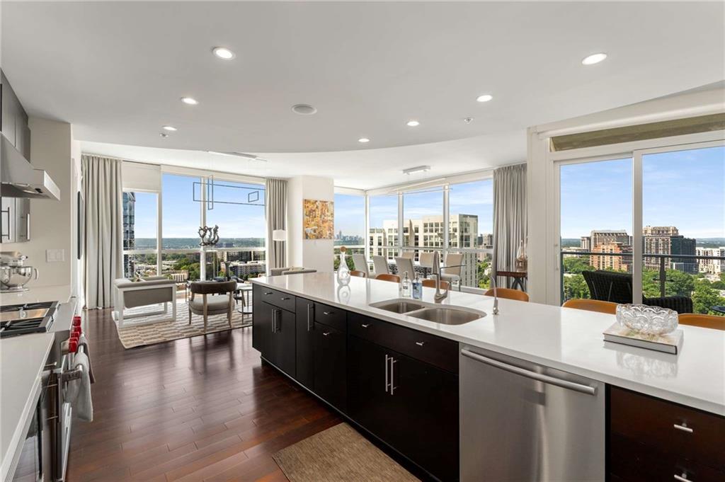 3325 Piedmont Road Northeast, Unit 2006 Atlanta, GA 30305 - Photo 9 of 78 a kitchen with lots of counter top space and living room