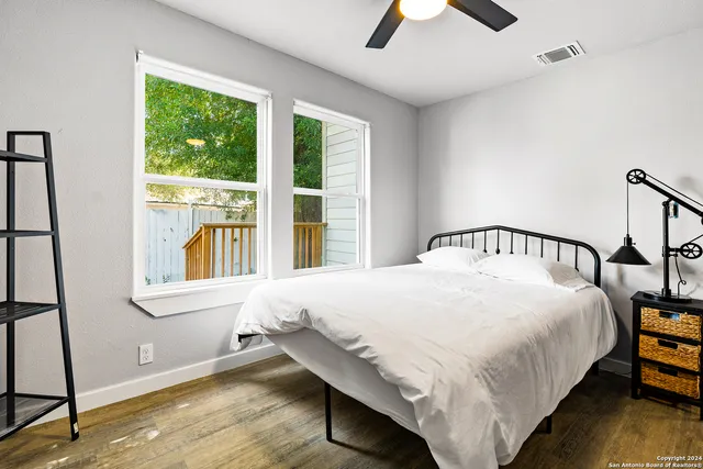a bedroom with a bed and window