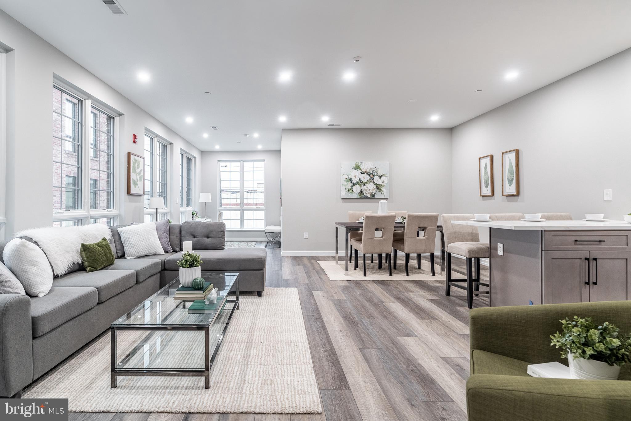 2412 Innovator Way Philadelphia, PA 19146 - Photo 1 of 117 a living room with furniture wooden floor and kitchen view