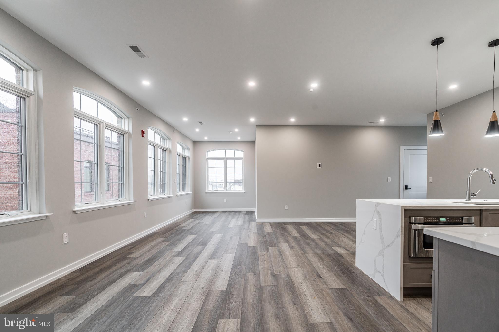 2412 Innovator Way Philadelphia, PA 19146 - Photo 103 of 117 a view of an empty room with wooden floor and a window