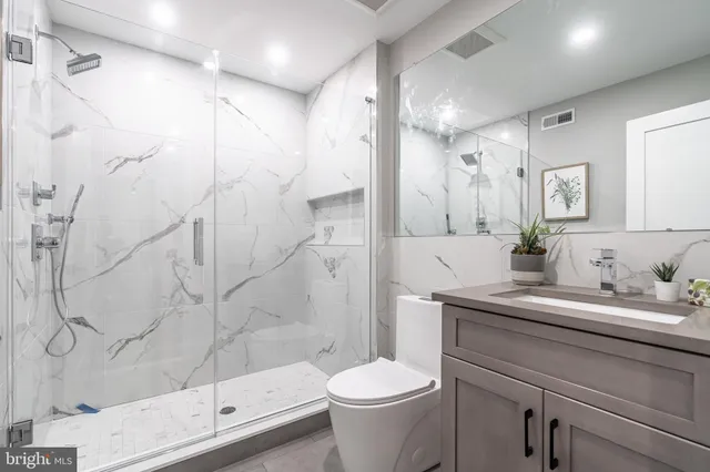 a kitchen with a refrigerator a sink and a stove