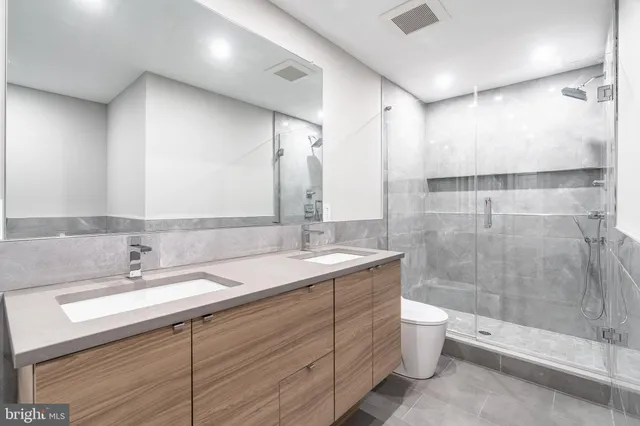 a kitchen with stainless steel appliances granite countertop a sink and a stove