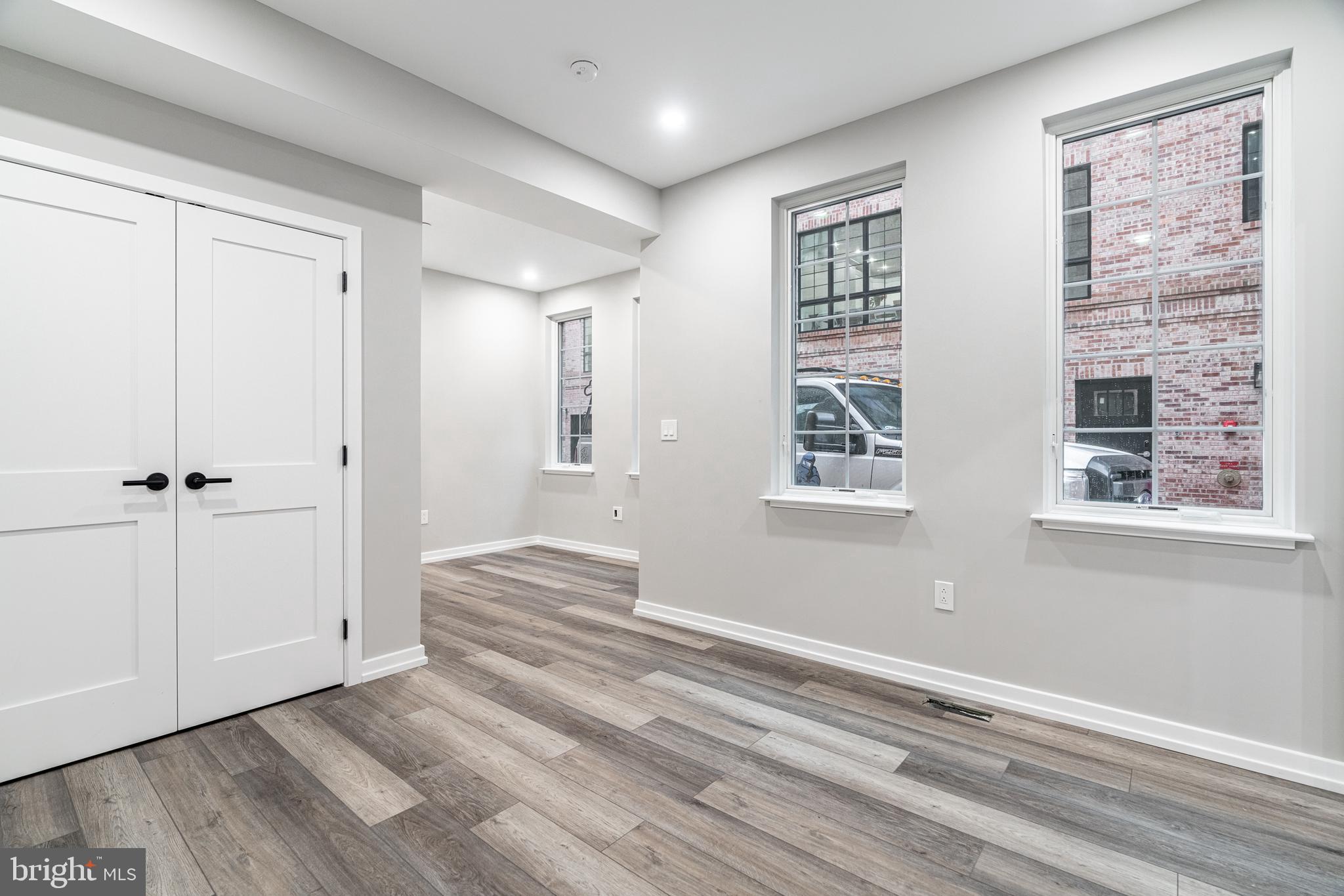 2412 Innovator Way Philadelphia, PA 19146 - Photo 39 of 117 a view of an empty room with wooden floor and a window