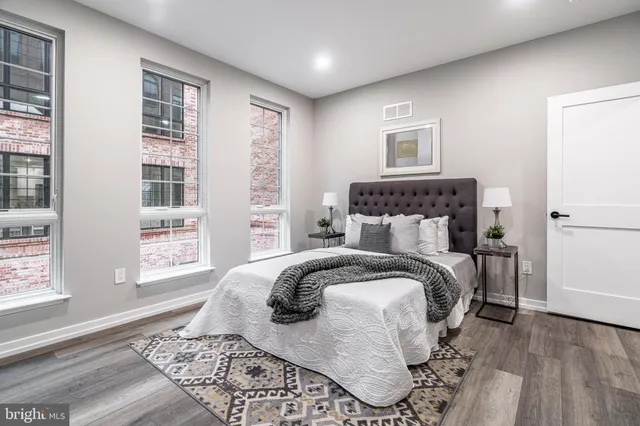 a bathroom with a double vanity sink toilet and shower