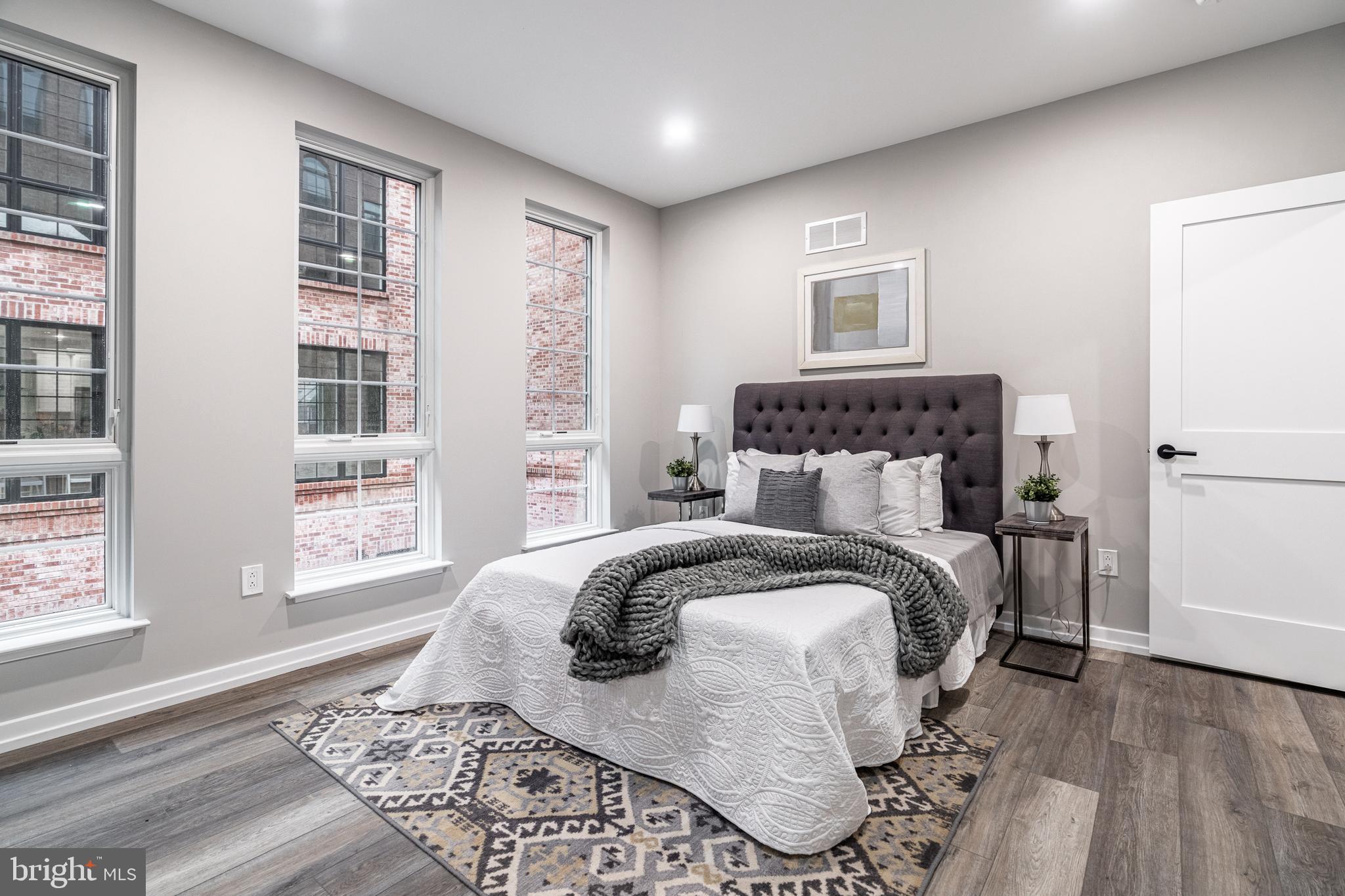 2412 Innovator Way Philadelphia, PA 19146 - Photo 4 of 117 a bedroom with a bed and wooden floor