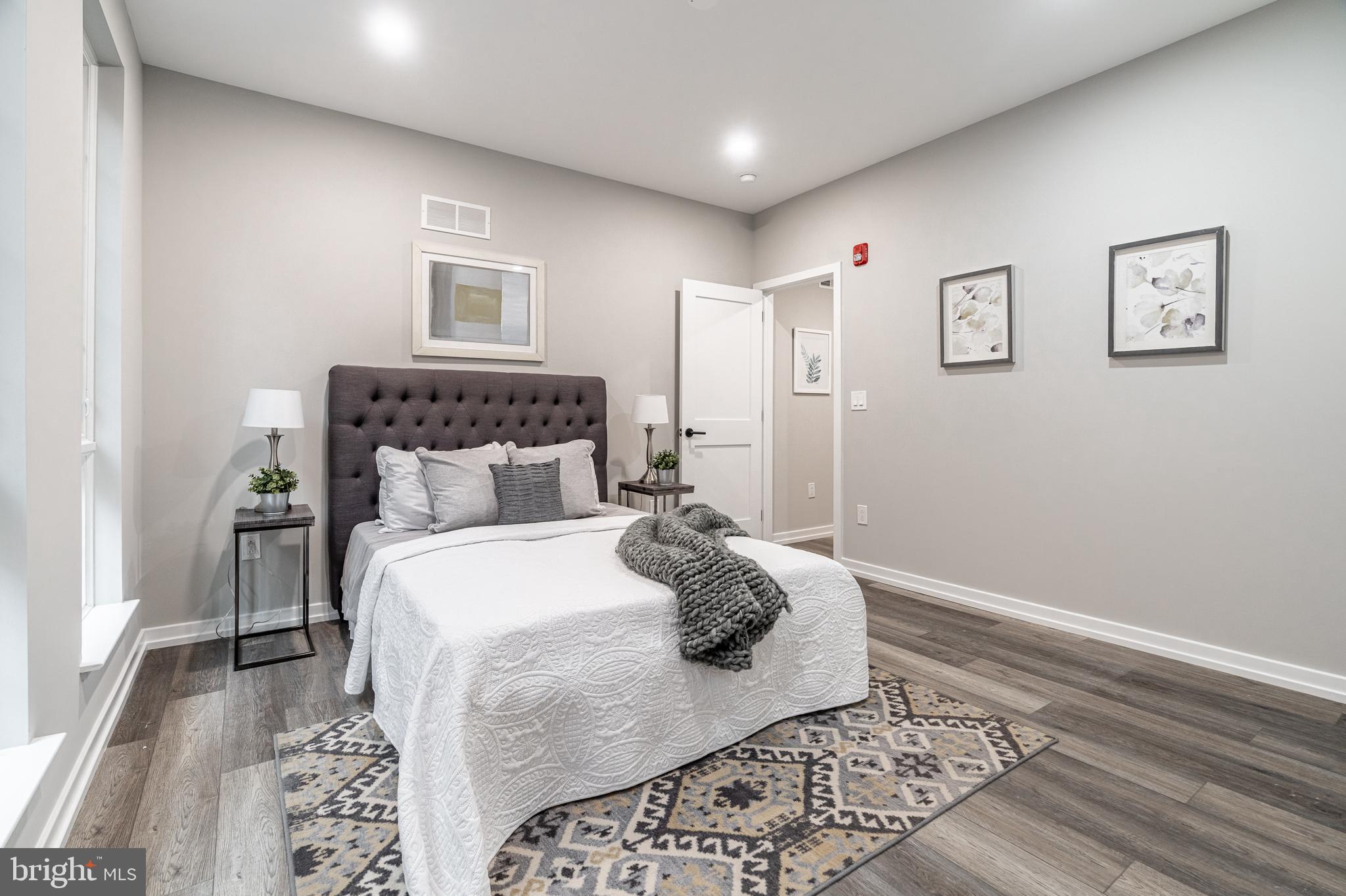 2412 Innovator Way Philadelphia, PA 19146 - Photo 48 of 117 a bed room with a bed and a lamp