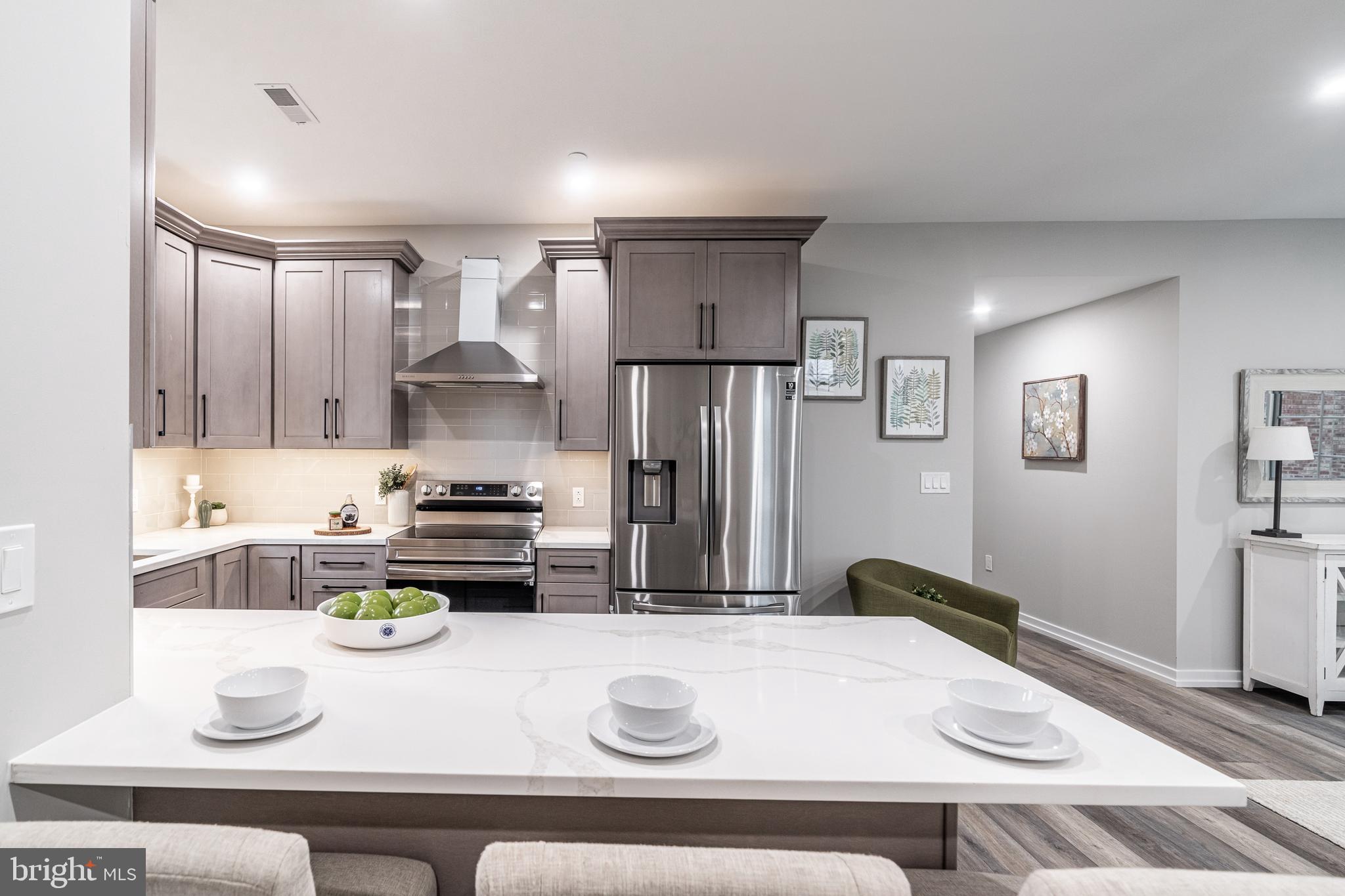 2412 Innovator Way Philadelphia, PA 19146 - Photo 59 of 117 a kitchen with a refrigerator and a stove top oven