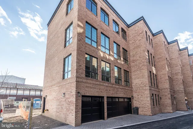 a front view of a building with large windows