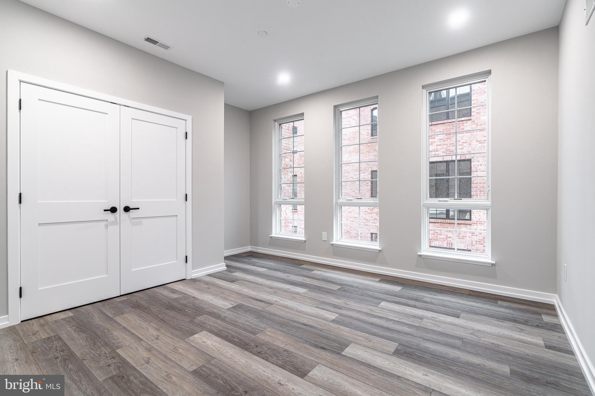 2412 Innovator Way Philadelphia, PA 19146 - Photo 67 of 117 a view of an empty room with a window and wooden floor