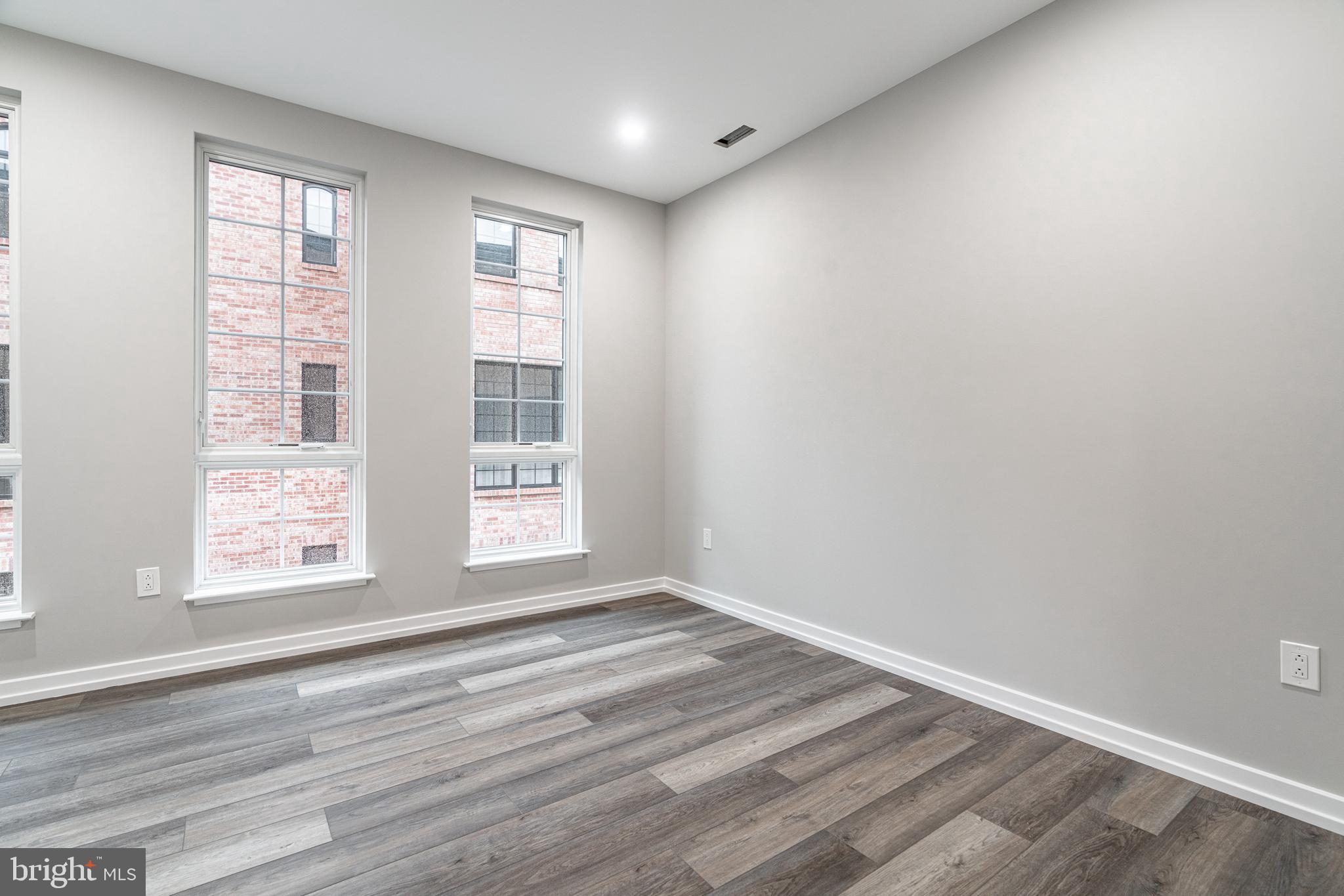 2412 Innovator Way Philadelphia, PA 19146 - Photo 74 of 117 a view of an empty room with wooden floor and a window