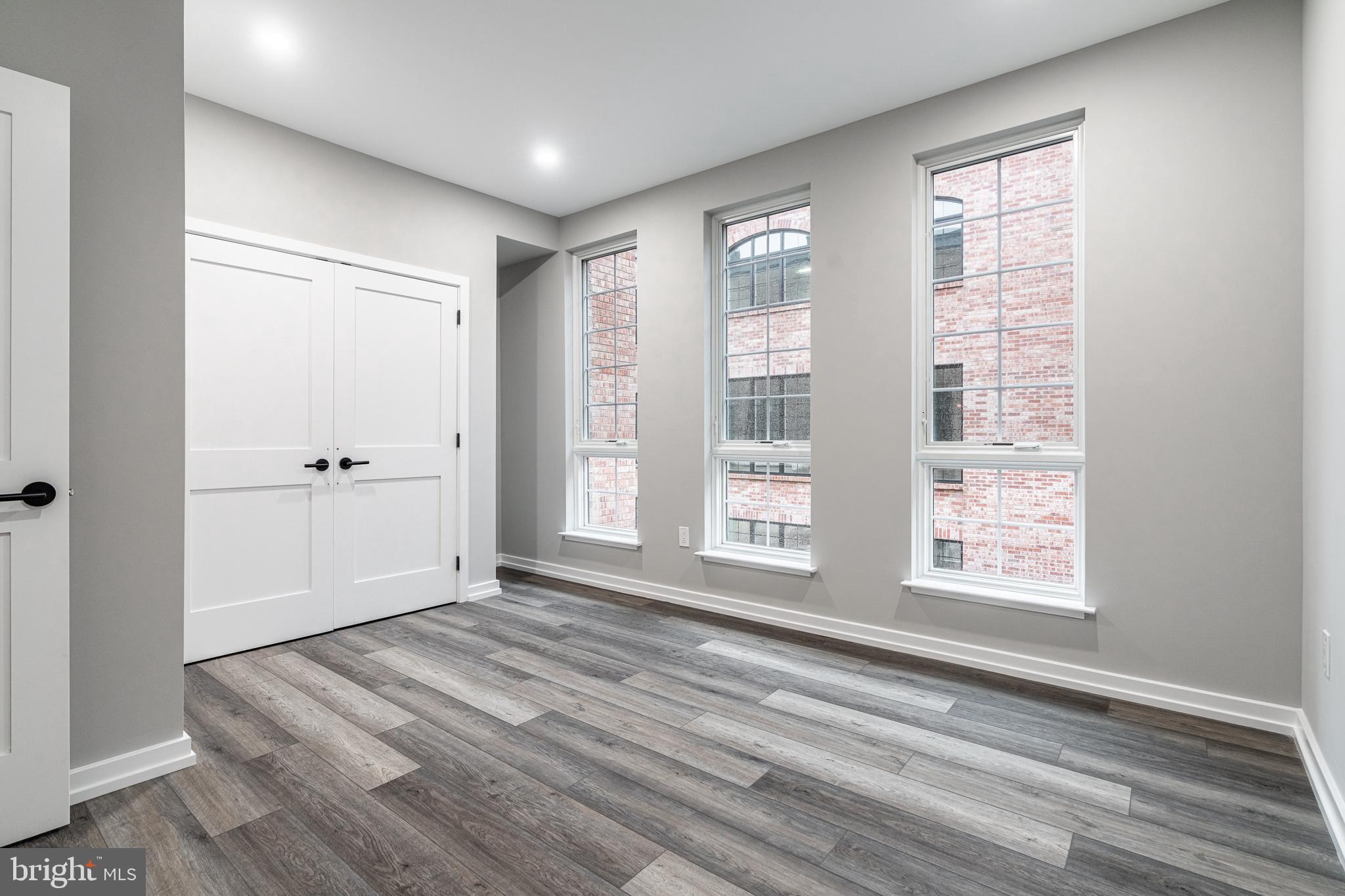 2412 Innovator Way Philadelphia, PA 19146 - Photo 75 of 117 a view of an empty room with wooden floor and a window