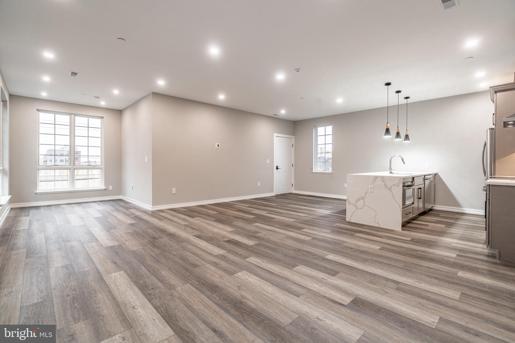 2412 Innovator Way Philadelphia, PA 19146 - Photo 79 of 117 a view of an empty room with a window and wooden floor