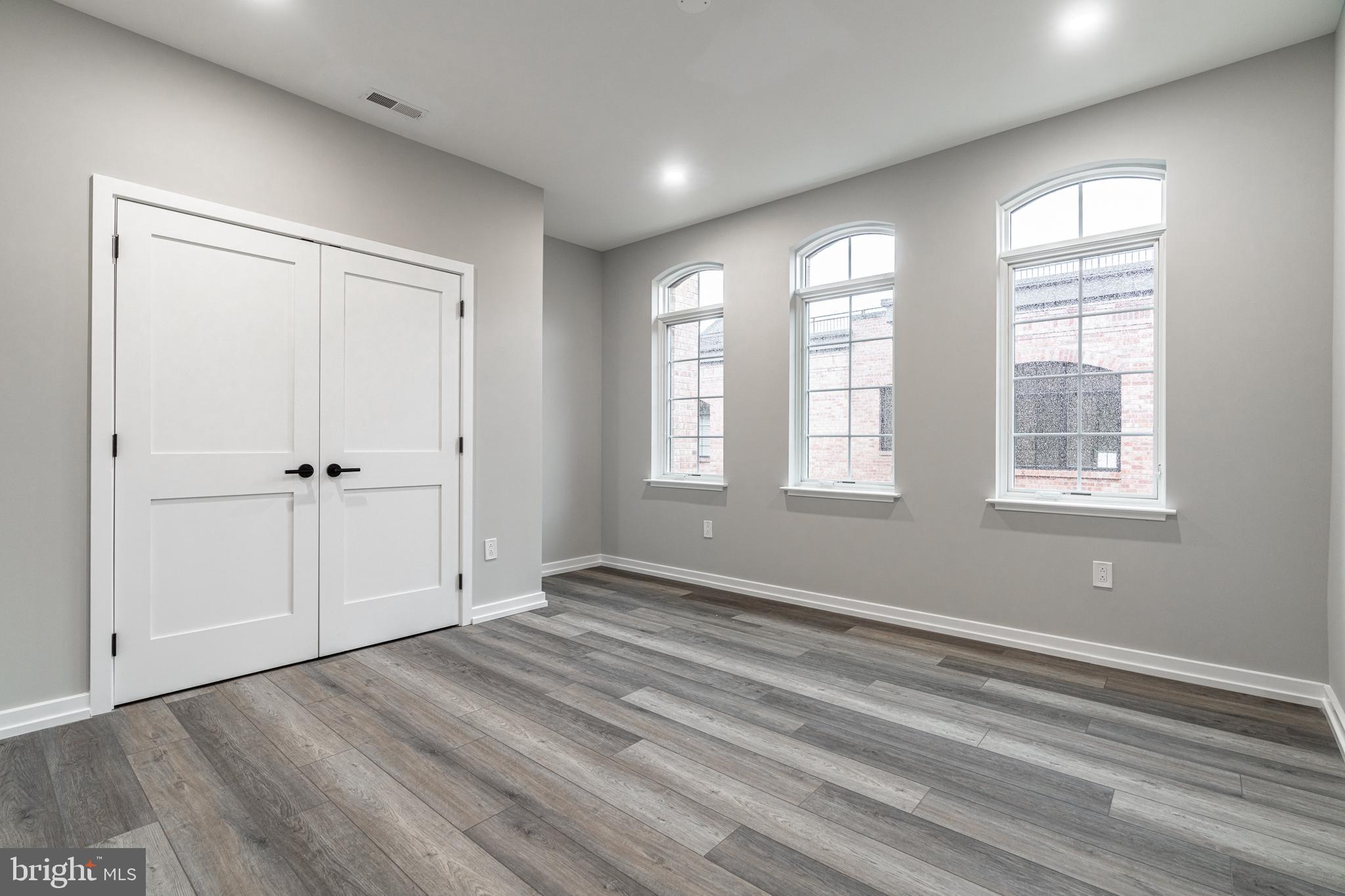 2412 Innovator Way Philadelphia, PA 19146 - Photo 92 of 117 a view of empty room with wooden floor and fan