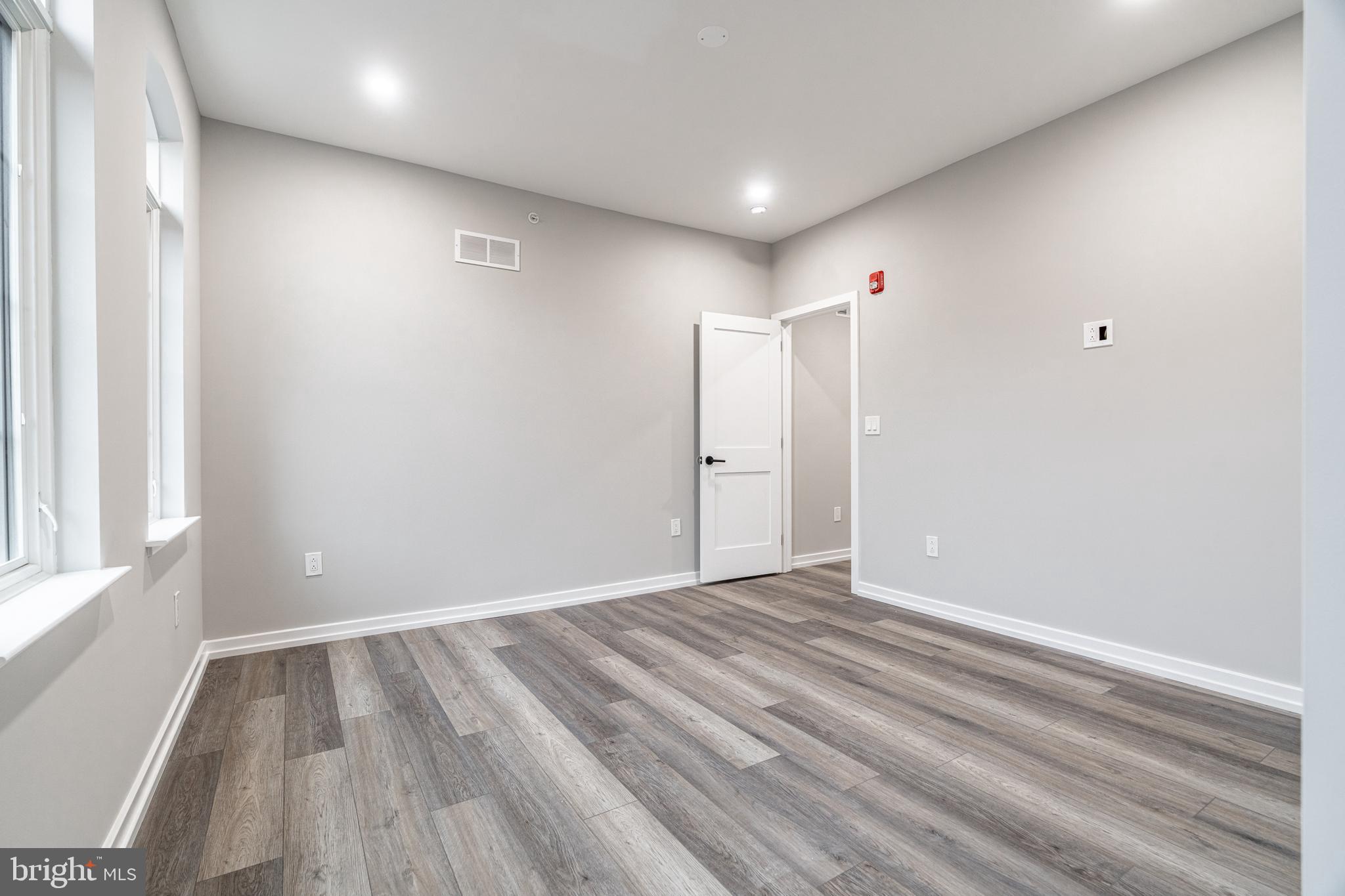 2412 Innovator Way Philadelphia, PA 19146 - Photo 93 of 117 a view of an empty room with wooden floor and a window
