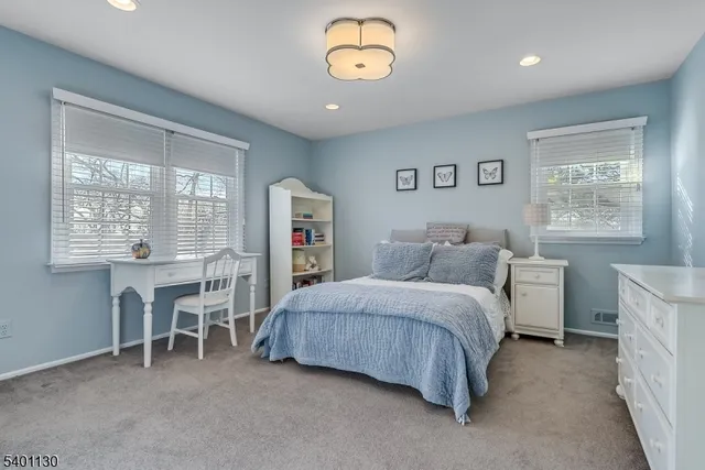 a bed room with a bed and a table