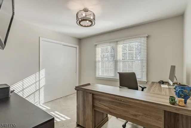 a view of a workspace with furniture