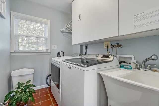 a kitchen with sink cabinets and a stove