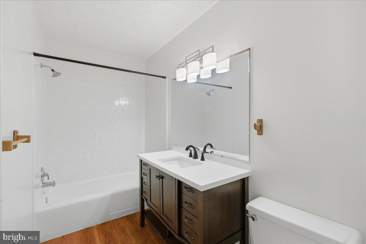 10177 Irongate Way Manassas, VA 20109 - Photo 11 of 28 a bathroom with a sink a toilet and shower