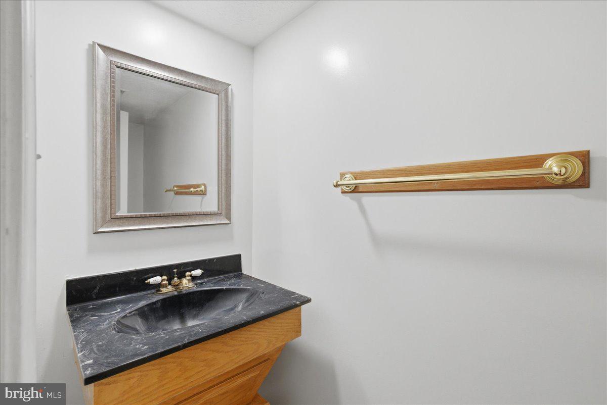 10177 Irongate Way Manassas, VA 20109 - Photo 22 of 28 a room with a sink and a mirror