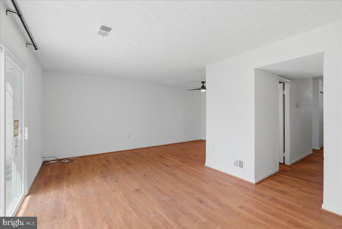 10177 Irongate Way Manassas, VA 20109 - Photo 4 of 28 a view of a room with wooden floor
