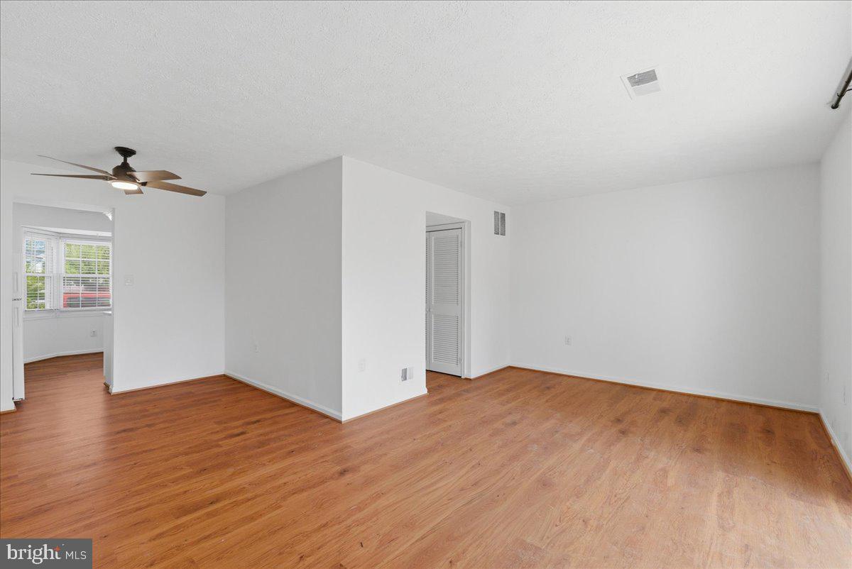 10177 Irongate Way Manassas, VA 20109 - Photo 5 of 28 a view of empty room with wooden floor
