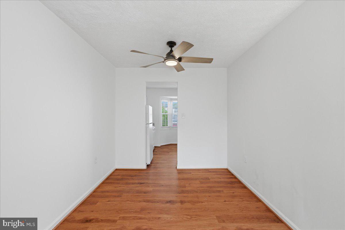 10177 Irongate Way Manassas, VA 20109 - Photo 7 of 28 a view of empty room with wooden floor