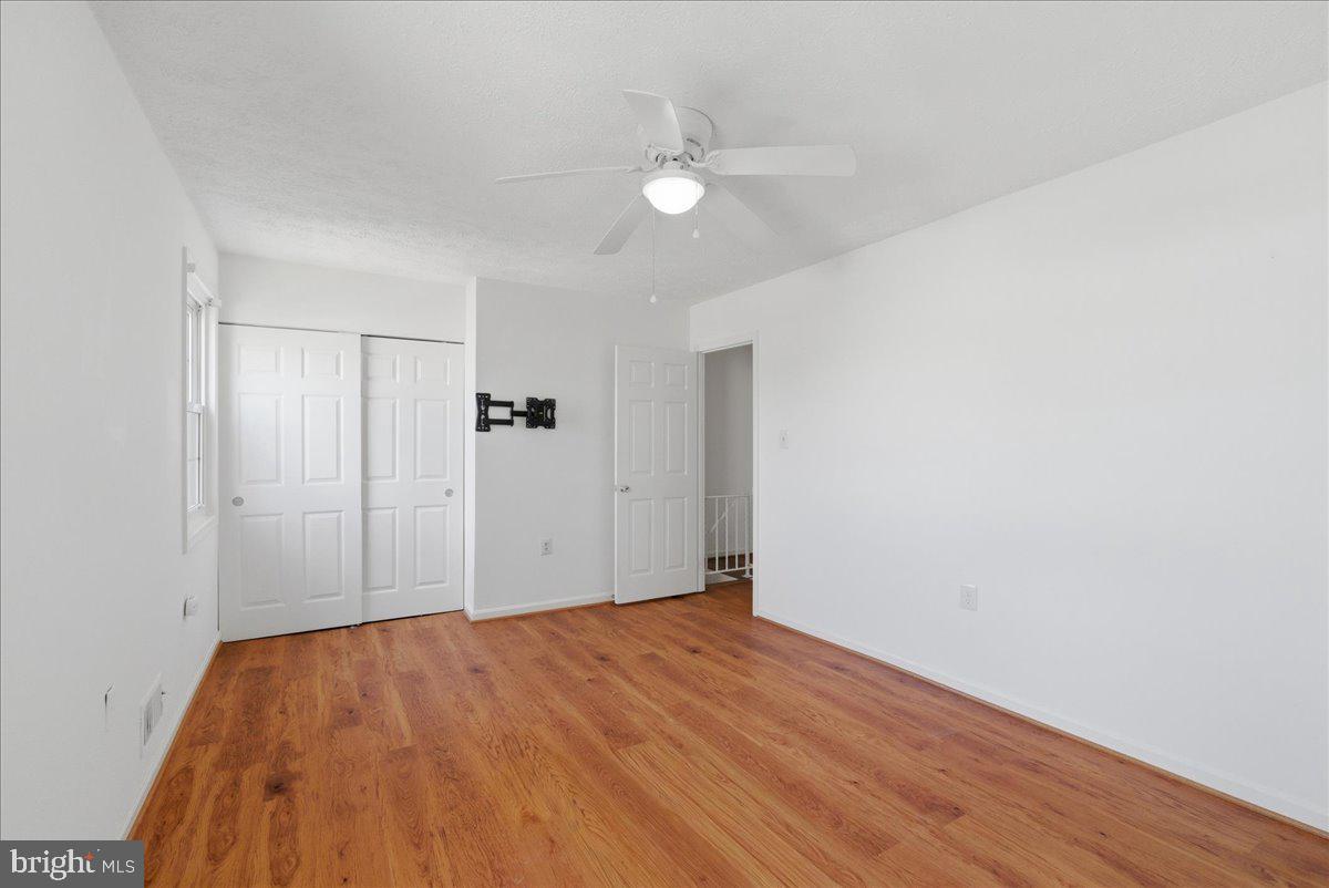 10177 Irongate Way Manassas, VA 20109 - Photo 10 of 28 a view of a big room with wooden floor and windows in a room