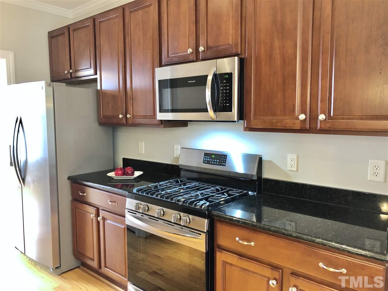 6107 Shandwick Court Raleigh, NC 27609 - Photo 5 of 21 New Refrigerator, Gas Range and Microwave Oven