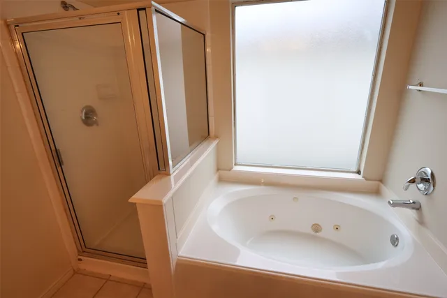 a white bath tub sitting next to a white sink