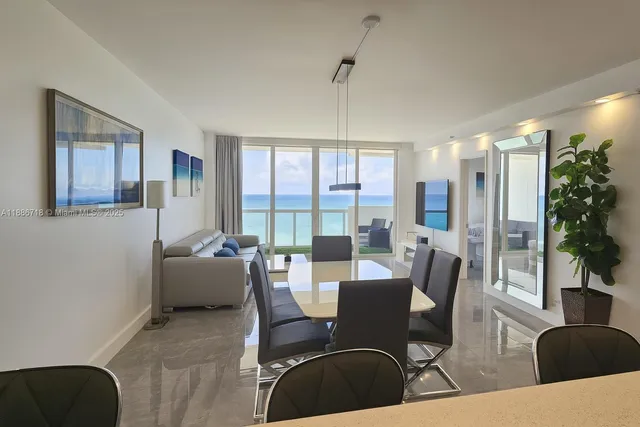 a view of a dining room with furniture window and outside view